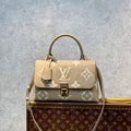 LV M46041 Louis Vuitton Madeleine MM Handbag Embossed Grained Cowhide Leather - Default Title - View 1