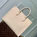 LV M46531 Louis Vuitton OnTheGo MM Bag Monogram Empreinte Beige - Default Title - View 1