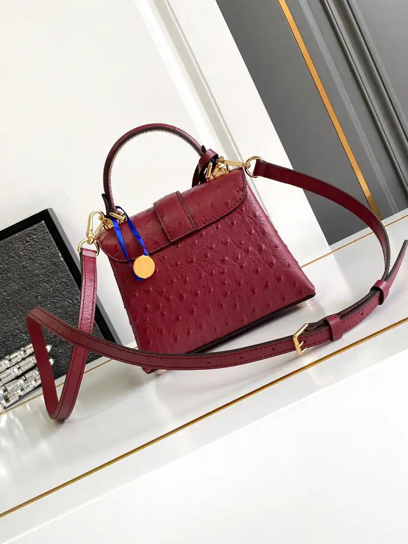 LV M87106 Louis Vuitton Ostrich Rose Des Vents Mini Wine Red
