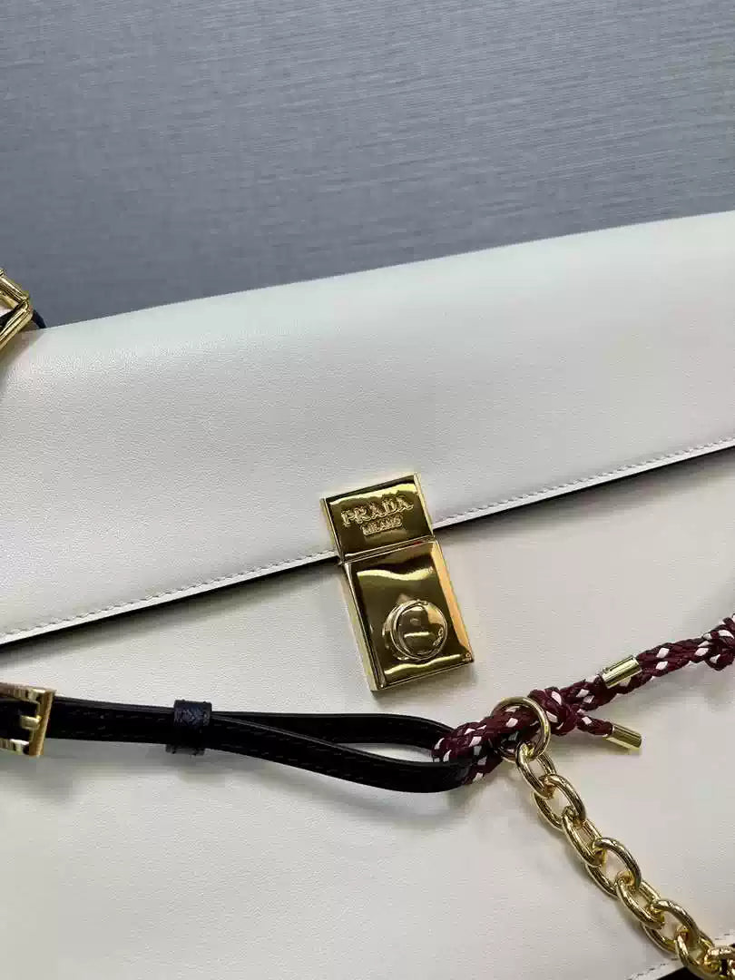 Prada 1BD378 Soft Sound large leather shoulder bag with charms White