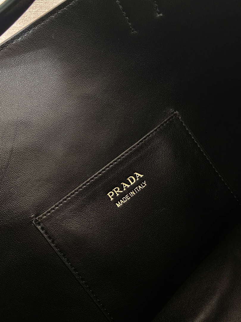 Prada 1BE085 Buckle leather bucket bag with belt Black