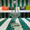 Prada 1NR015 Embellished satin and leather mini-pouch Light green