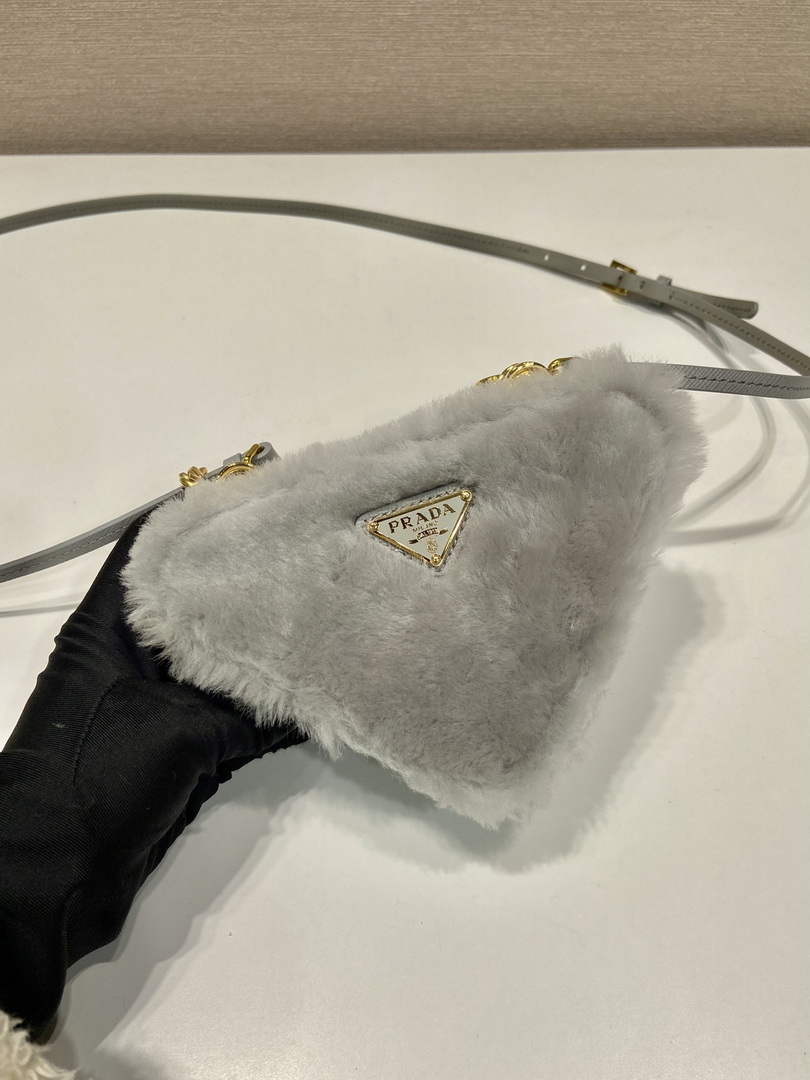 Prada 1NR015 Shearling and Saffiano leather mini-pouch Cornflower
