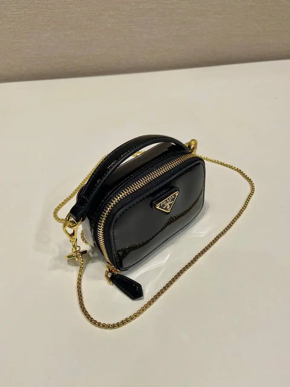 Prada 1NR025 Patent leather mini-pouch Black