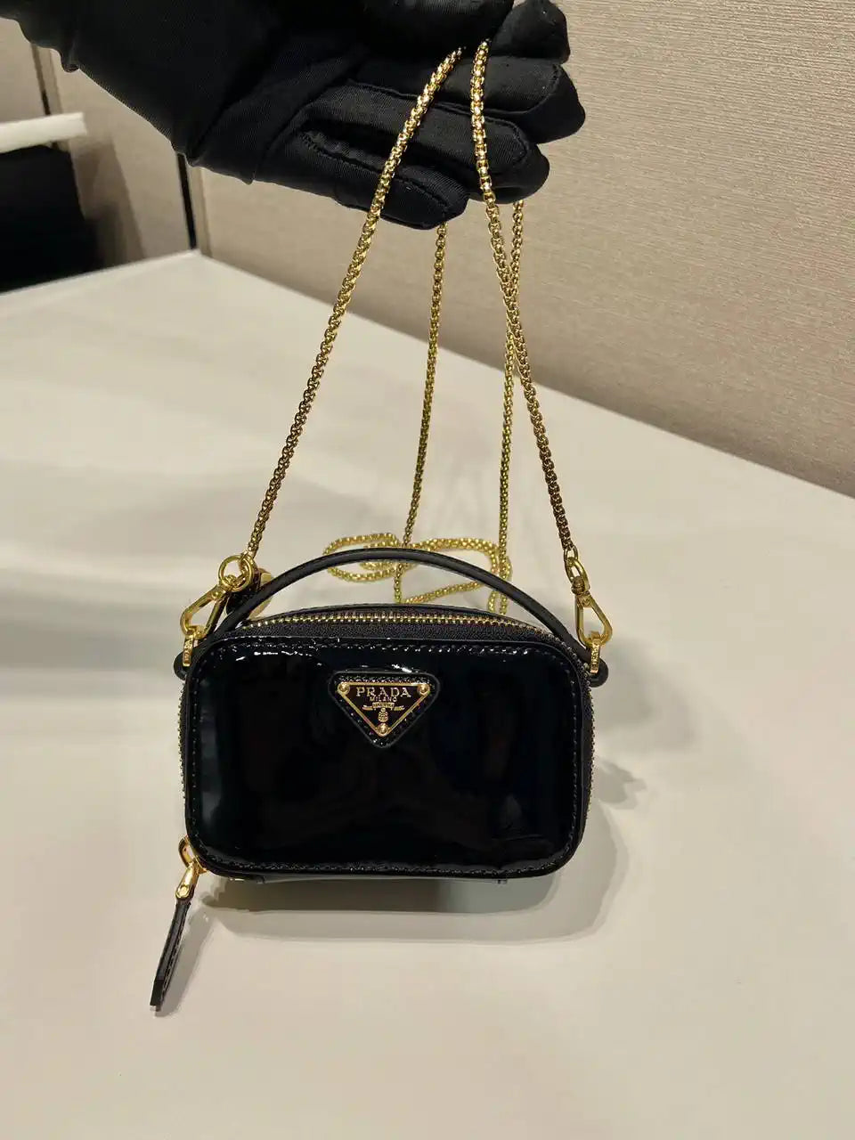 Prada 1NR025 Patent leather mini-pouch Black