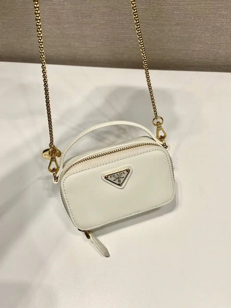 Prada 1NR025 Patent leather mini-pouch White