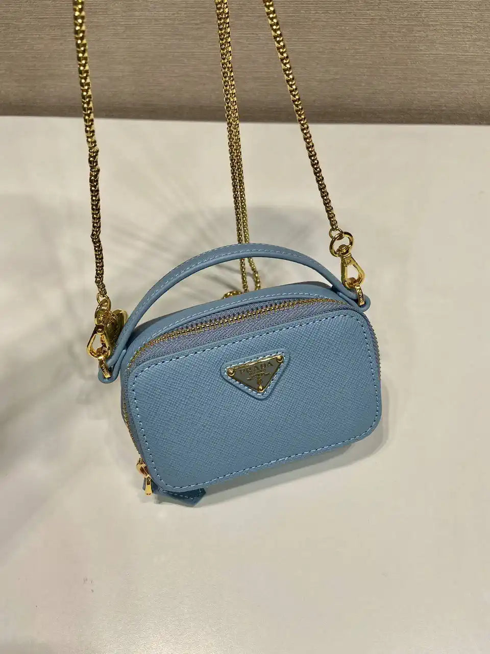 Prada 1NR025 Saffiano leather mini-pouch Blue