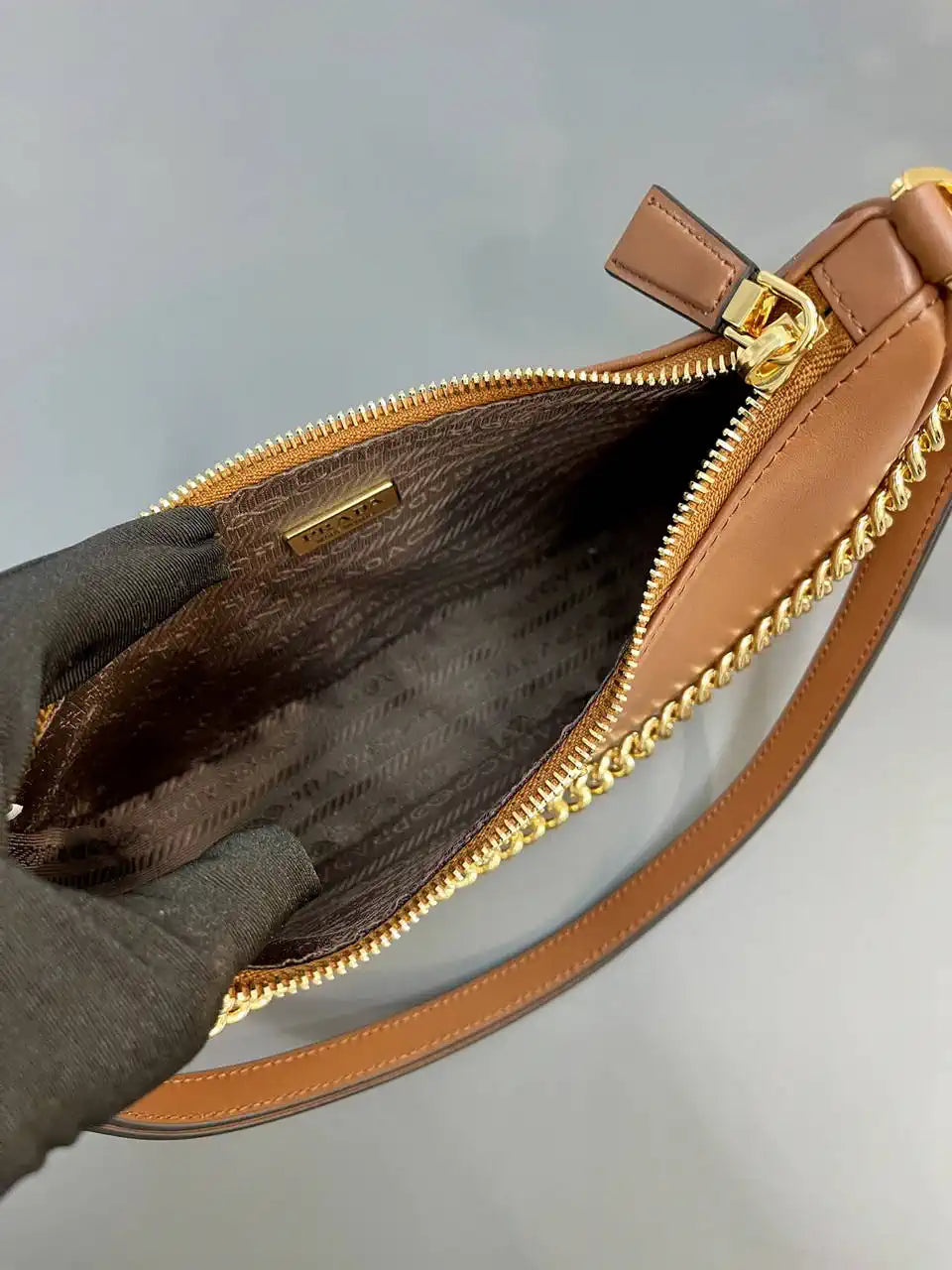 Prada Re-Edition leather mini-bag 1BC204 Brown