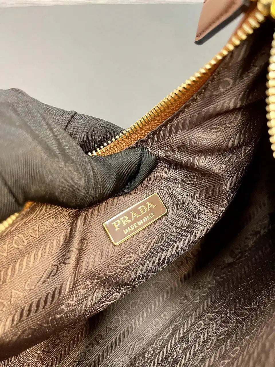 Prada Re-Edition leather mini-bag 1BC204 Brown