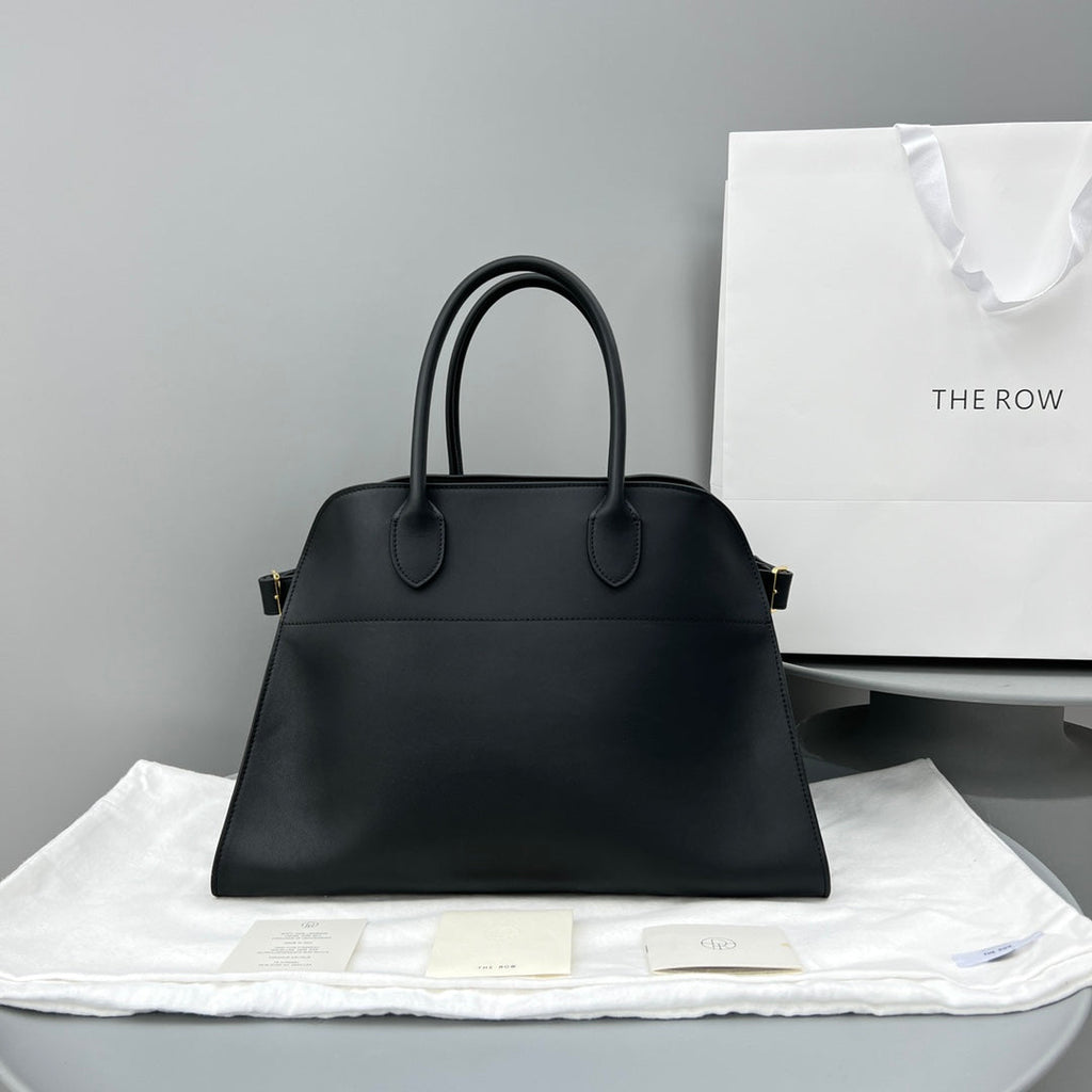 The Row W1255L72 Calfskin Margaux 15 Air buckled textured-leather tote T10990