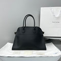 The Row W1255L72 Calfskin Margaux 15 Air buckled textured-leather tote T10990