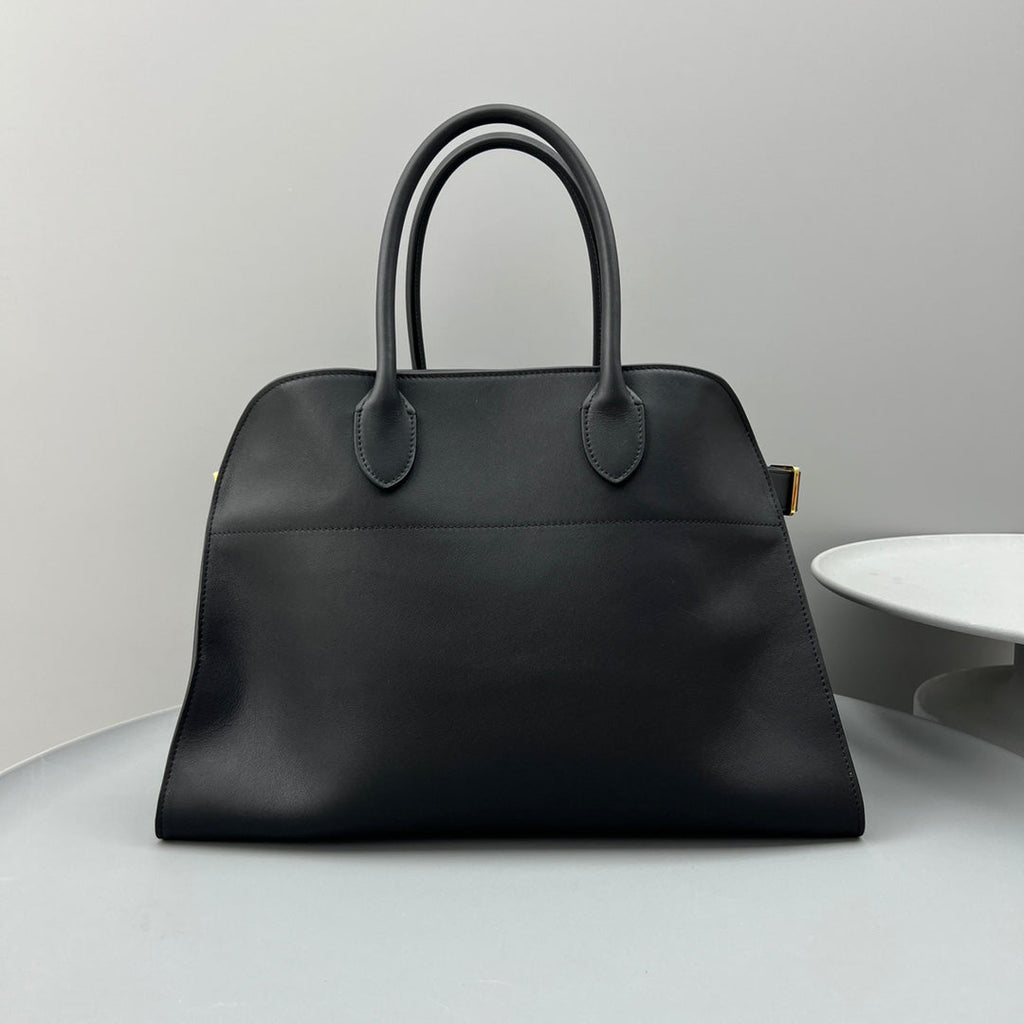 The Row W1255L72 Calfskin Margaux 15 Air buckled textured-leather tote T10990
