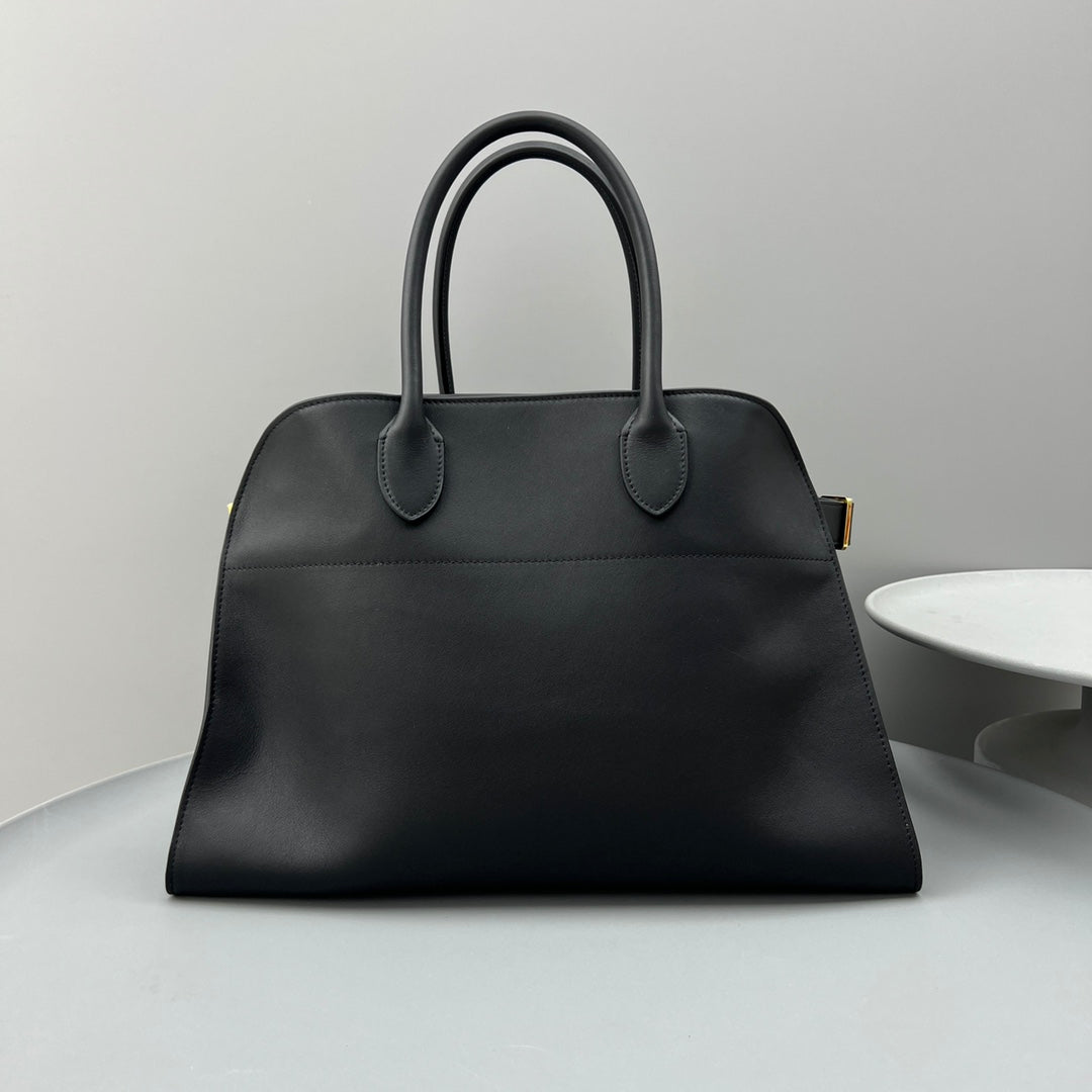 The Row W1255L72 Calfskin Margaux 15 Air buckled textured-leather tote T10990
