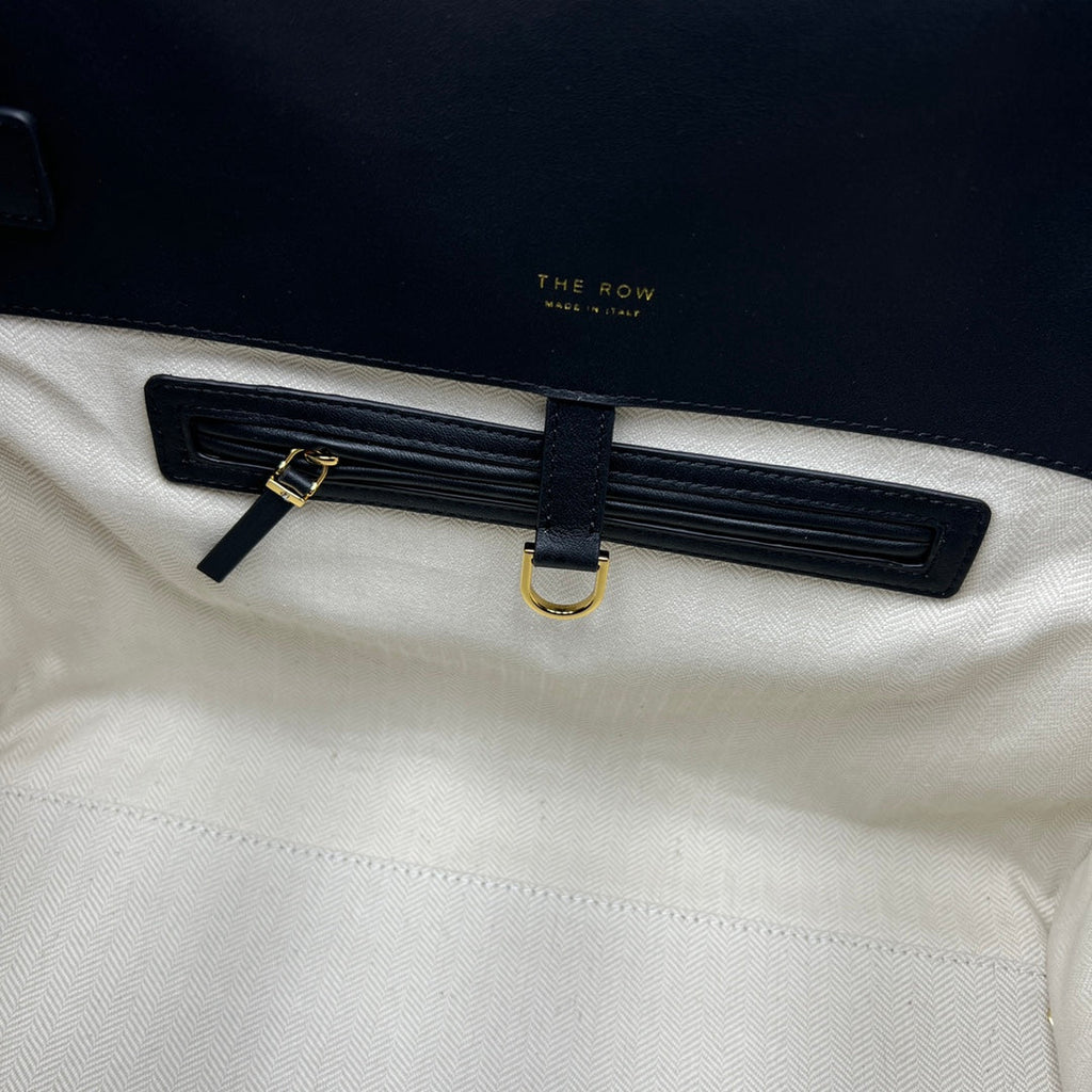 The Row W1255L72 Calfskin Margaux 15 Air buckled textured-leather tote T10990