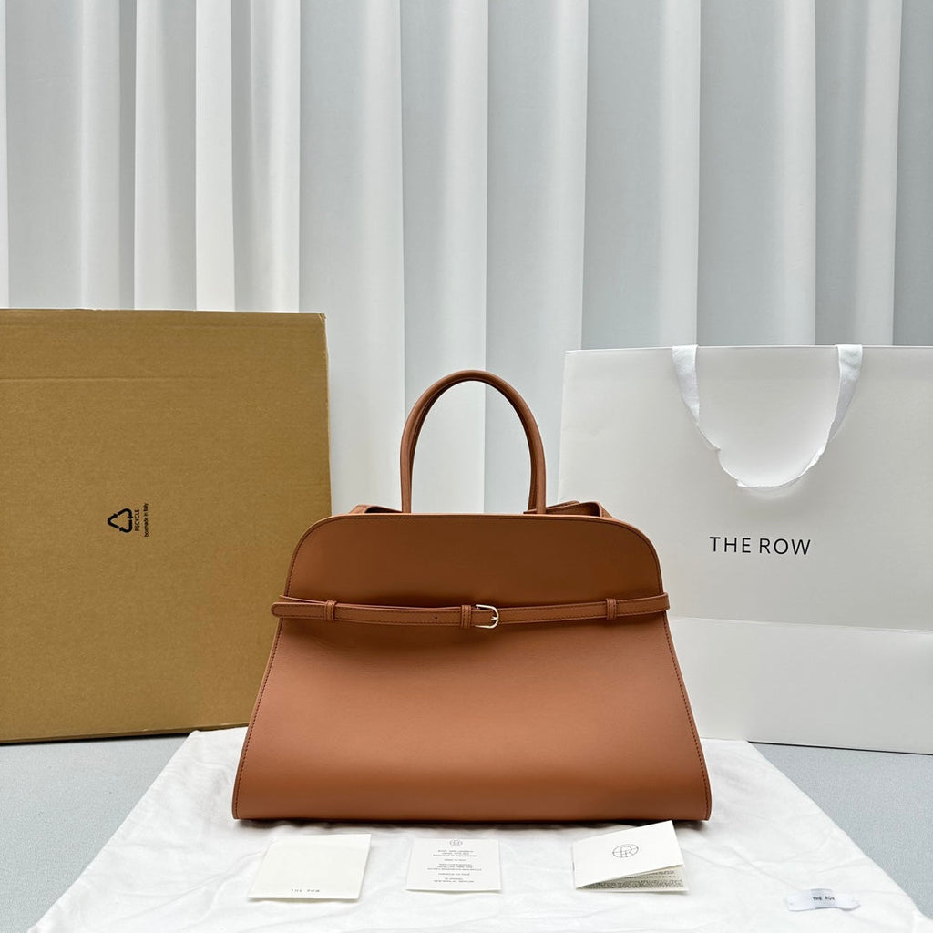 The Row W1255L72 Calfskin Margaux 15 Air buckled textured-leather tote T10991