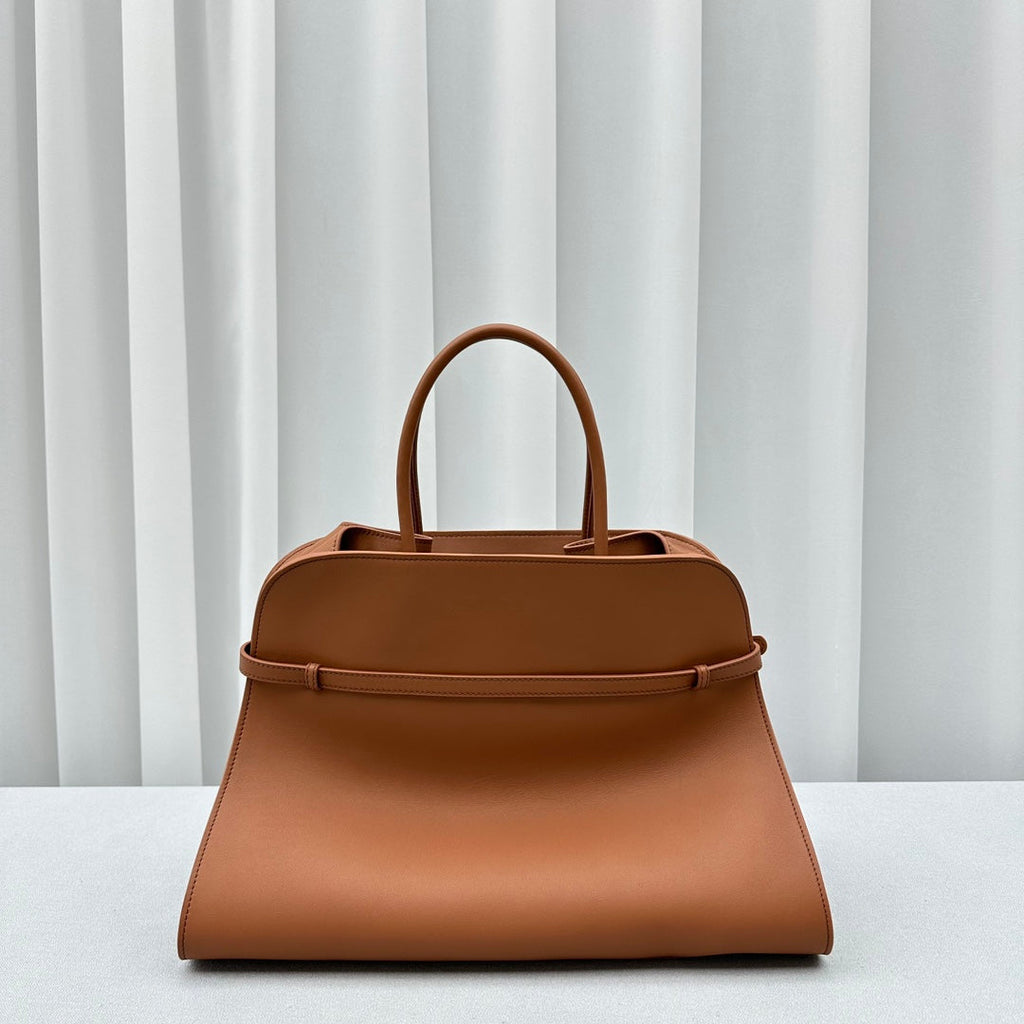 The Row W1255L72 Calfskin Margaux 15 Air buckled textured-leather tote T10991