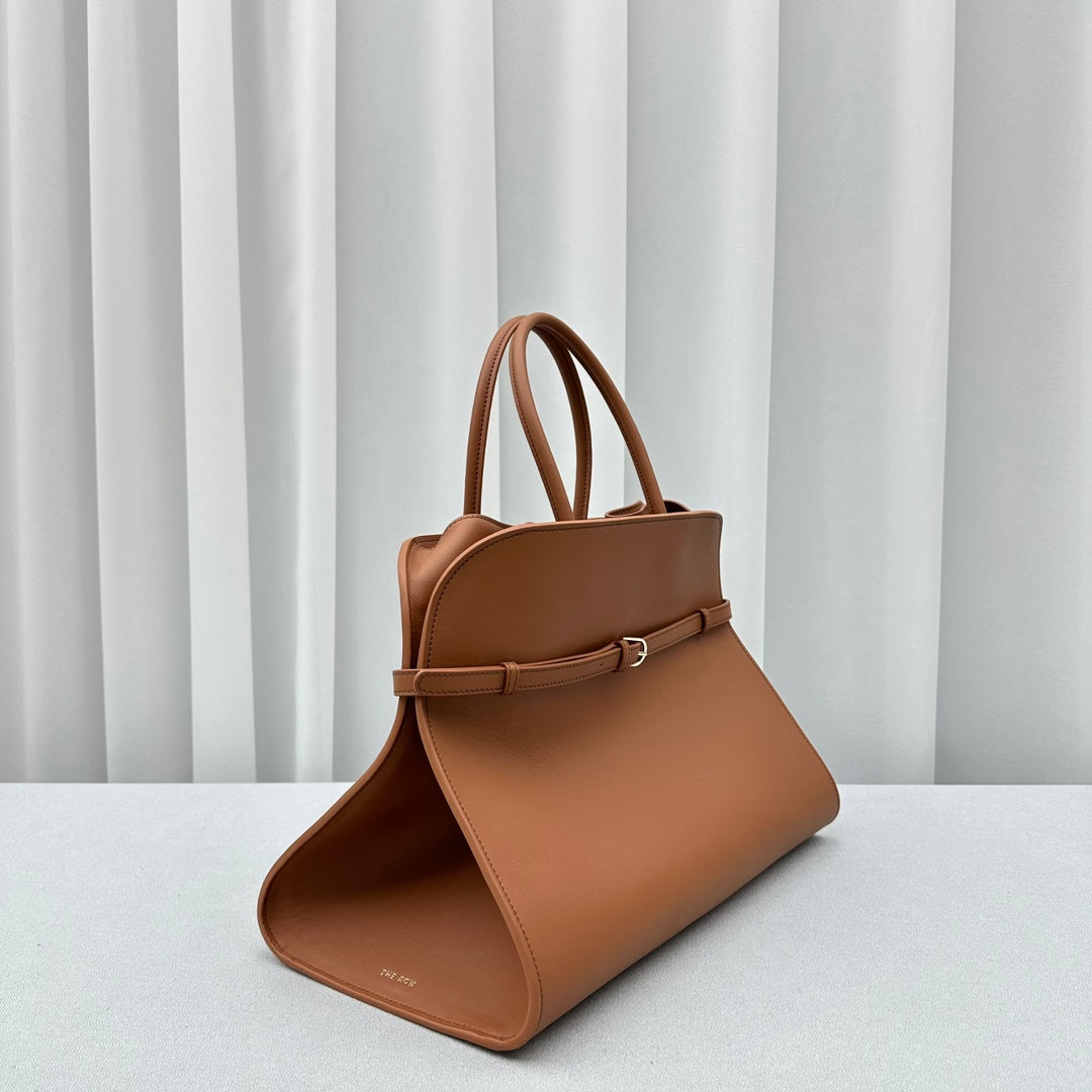 The Row W1255L72 Calfskin Margaux 15 Air buckled textured-leather tote T10991