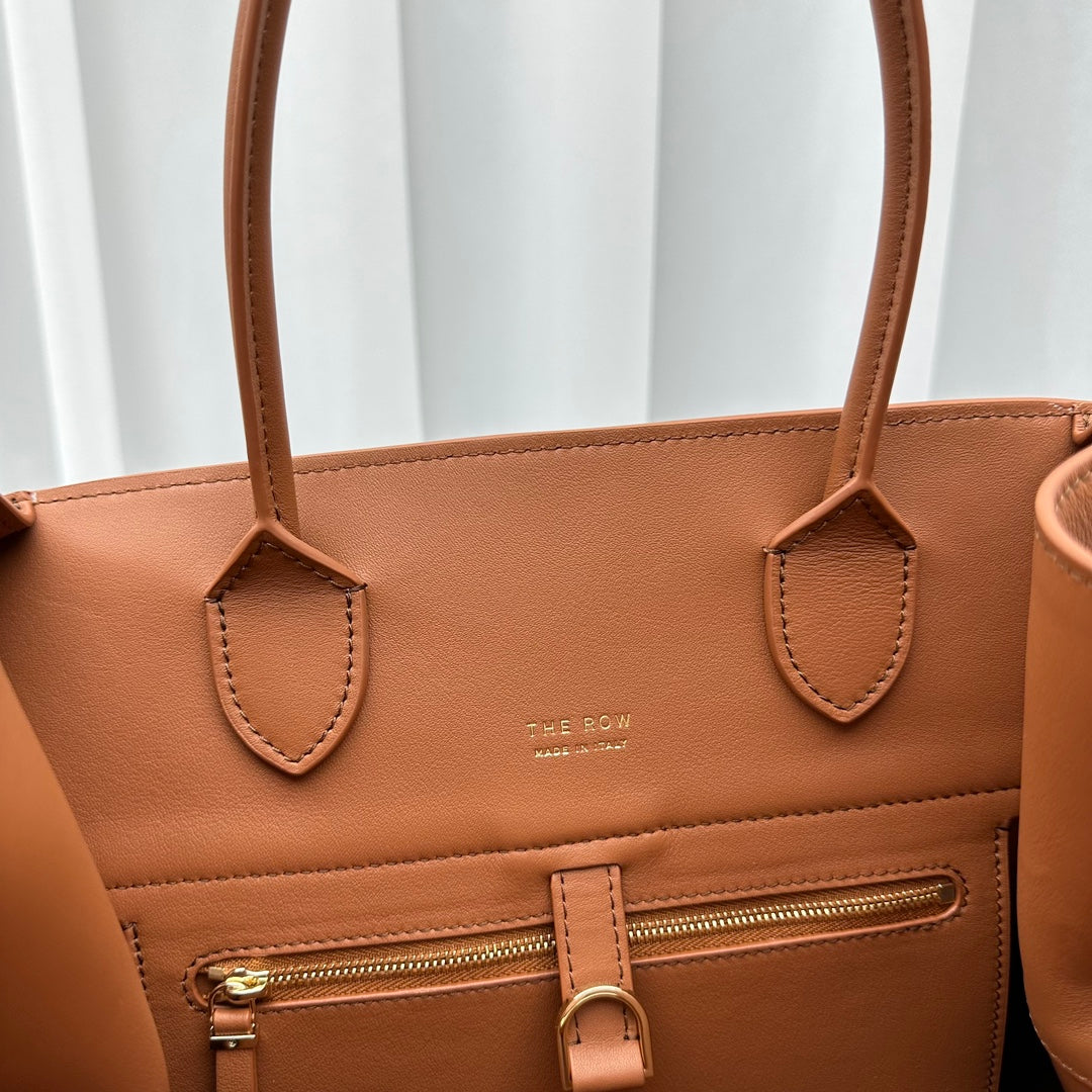 The Row W1255L72 Calfskin Margaux 15 Air buckled textured-leather tote T10991