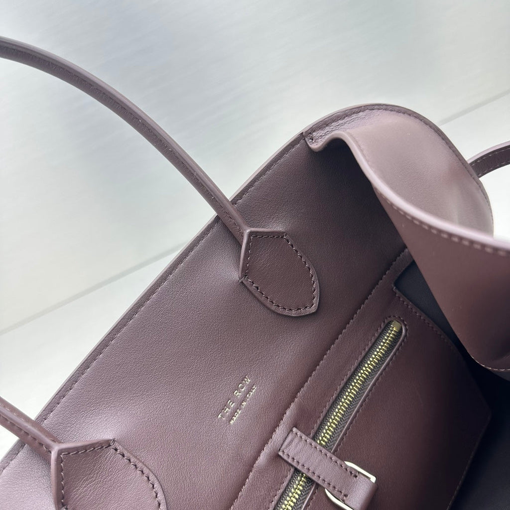 The Row W1255L72 Calfskin Margaux 15 Air buckled textured-leather tote T10992