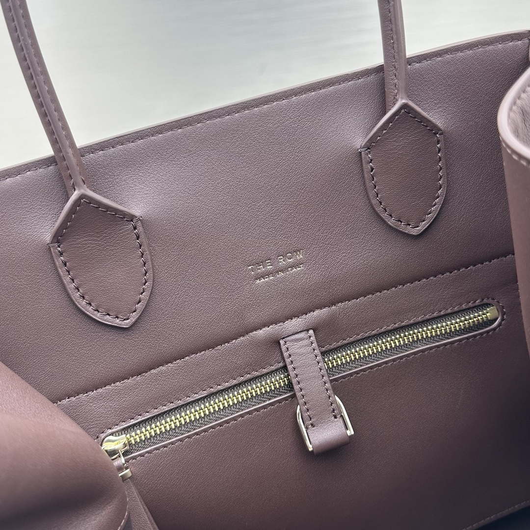 The Row W1255L72 Calfskin Margaux 15 Air buckled textured-leather tote T10992