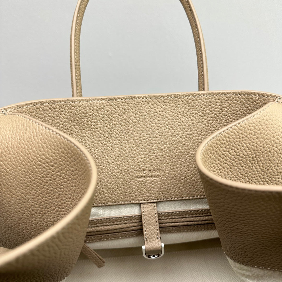 The Row W1255L72 Calfskin Margaux 15 Air buckled textured-leather tote T10994