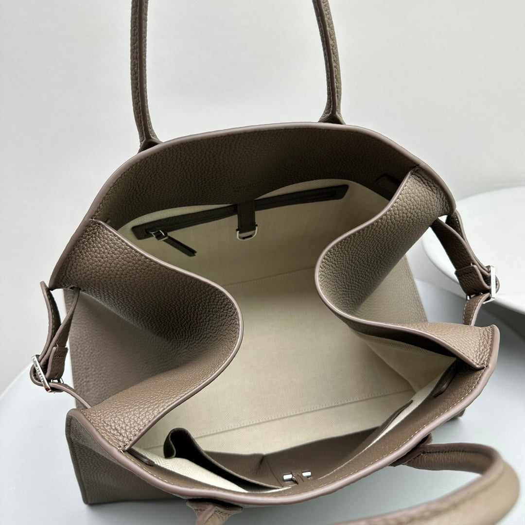 The Row W1255L72 Calfskin Margaux 15 Air buckled textured-leather tote T10995