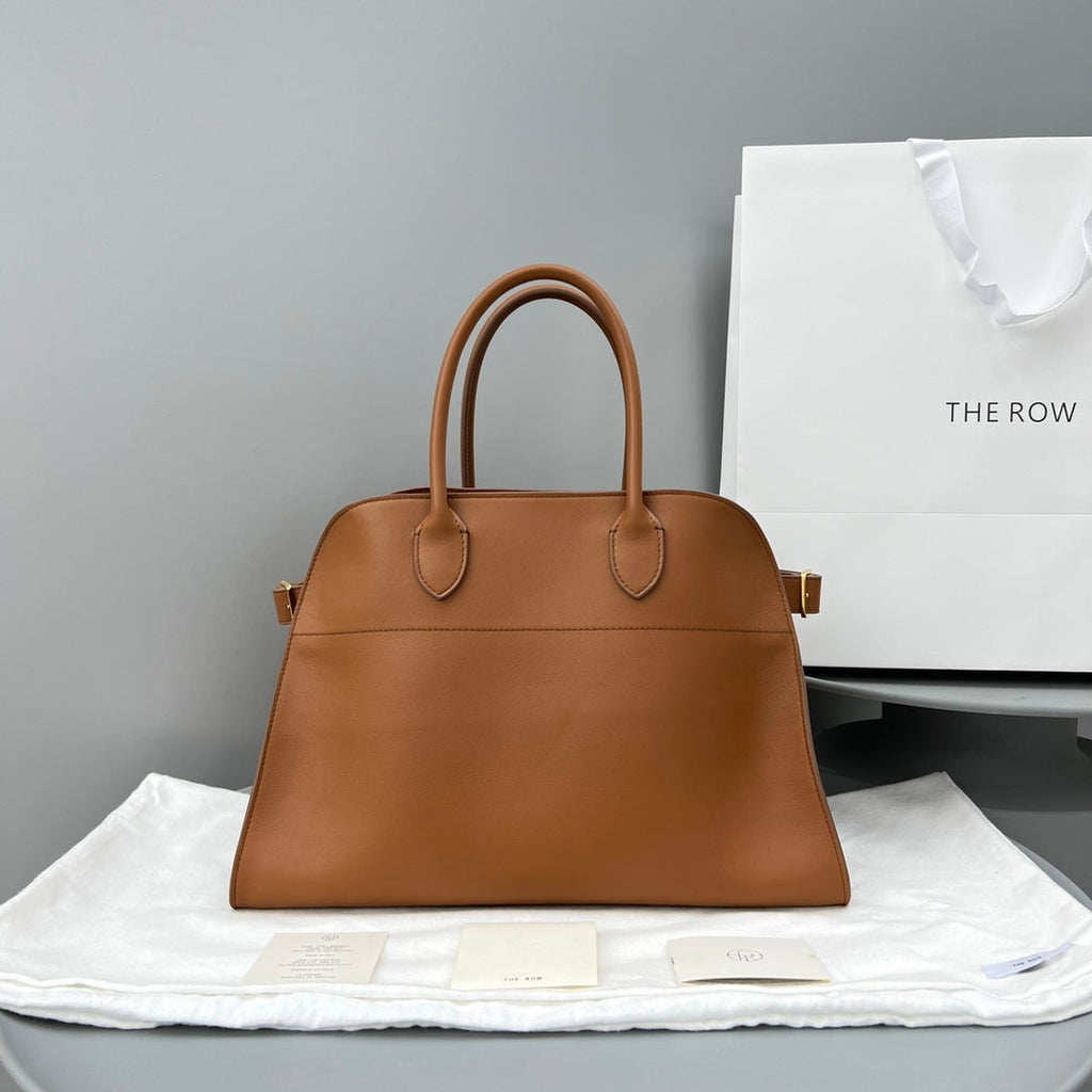 The Row W1255L72 Calfskin Margaux 15 Air buckled textured-leather tote T10996