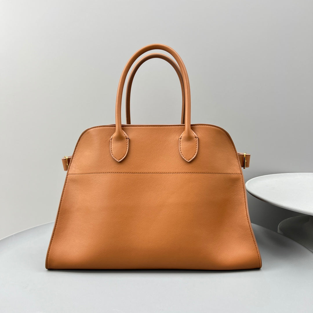 The Row W1255L72 Calfskin Margaux 15 Air buckled textured-leather tote T10996
