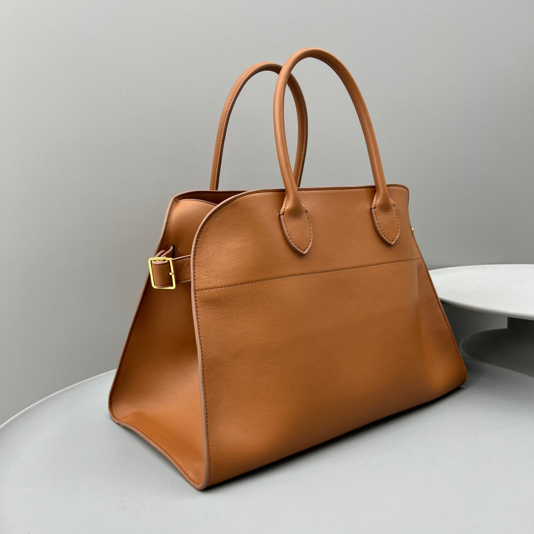 The Row W1255L72 Calfskin Margaux 15 Air buckled textured-leather tote T10996