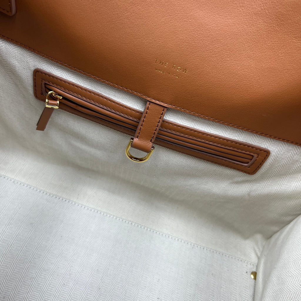 The Row W1255L72 Calfskin Margaux 15 Air buckled textured-leather tote T10996