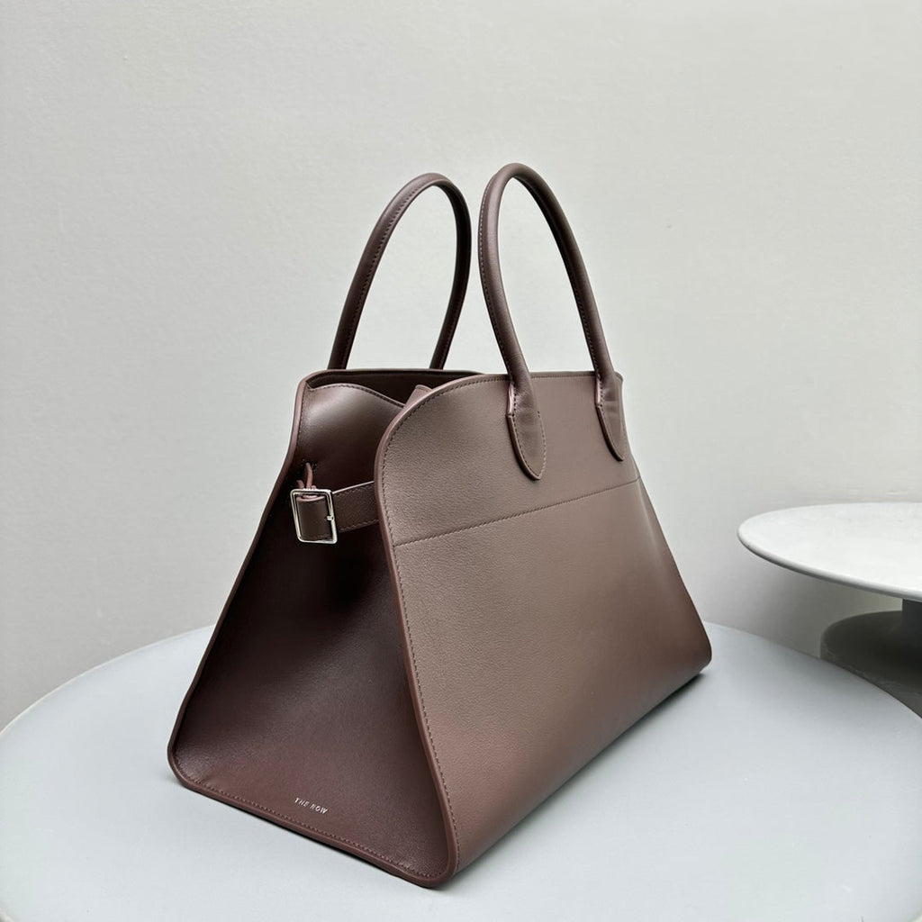 The Row W1255L72 Calfskin Margaux 15 Air buckled textured-leather tote T10997