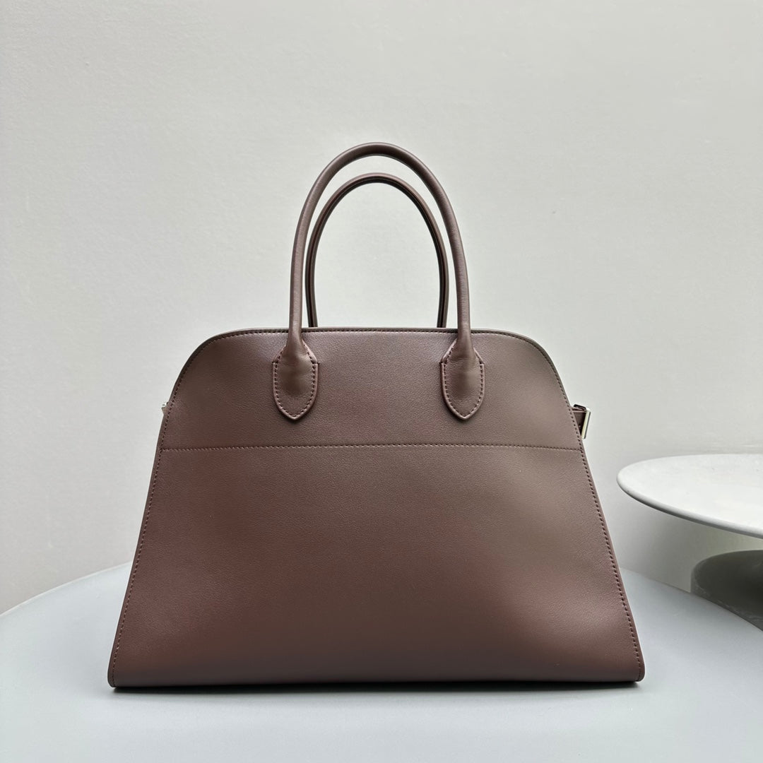 The Row W1255L72 Calfskin Margaux 15 Air buckled textured-leather tote T10997