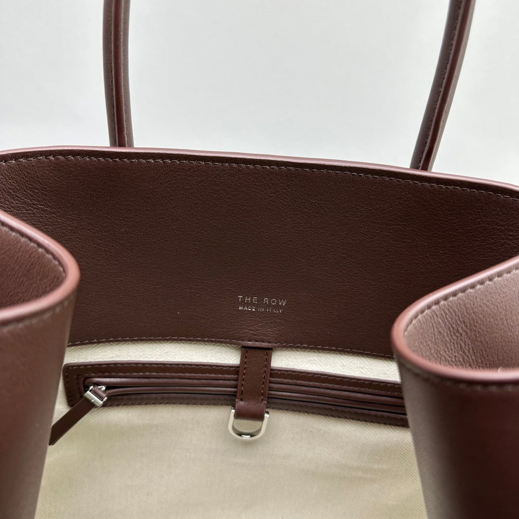 The Row W1255L72 Calfskin Margaux 15 Air buckled textured-leather tote T10997
