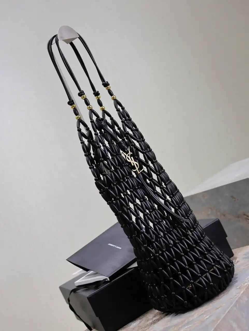 YSL 821911 supple bucket in wood beads Black