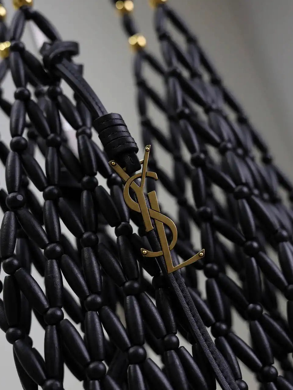 YSL 821911 supple bucket in wood beads Black
