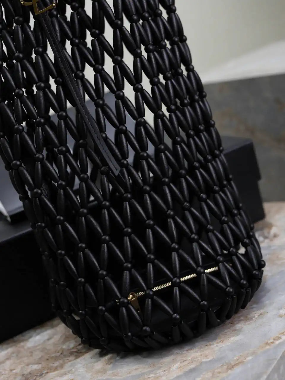 YSL 821911 supple bucket in wood beads Black